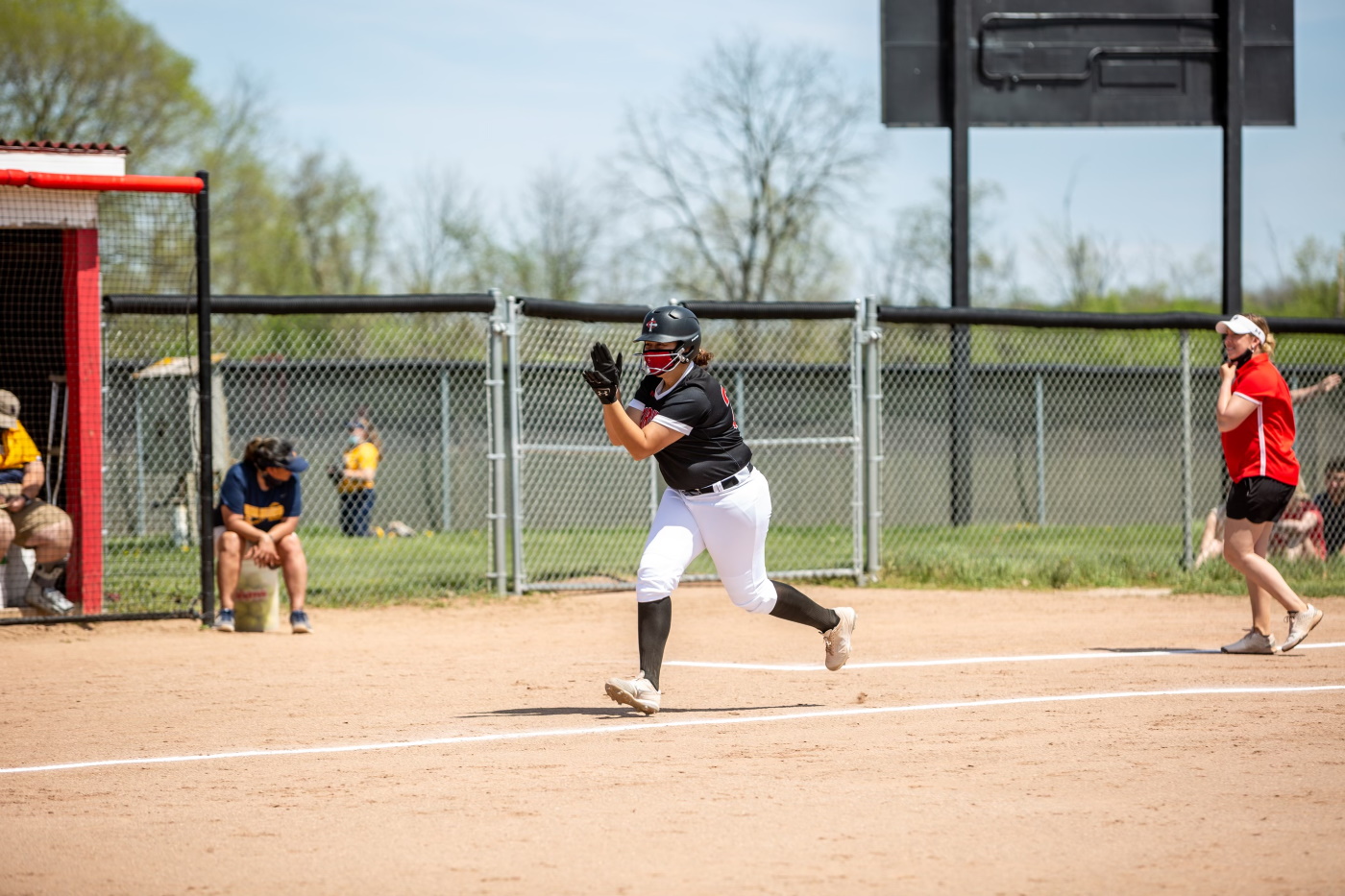 Kendall Kahl rounds third base after her 3-run home run